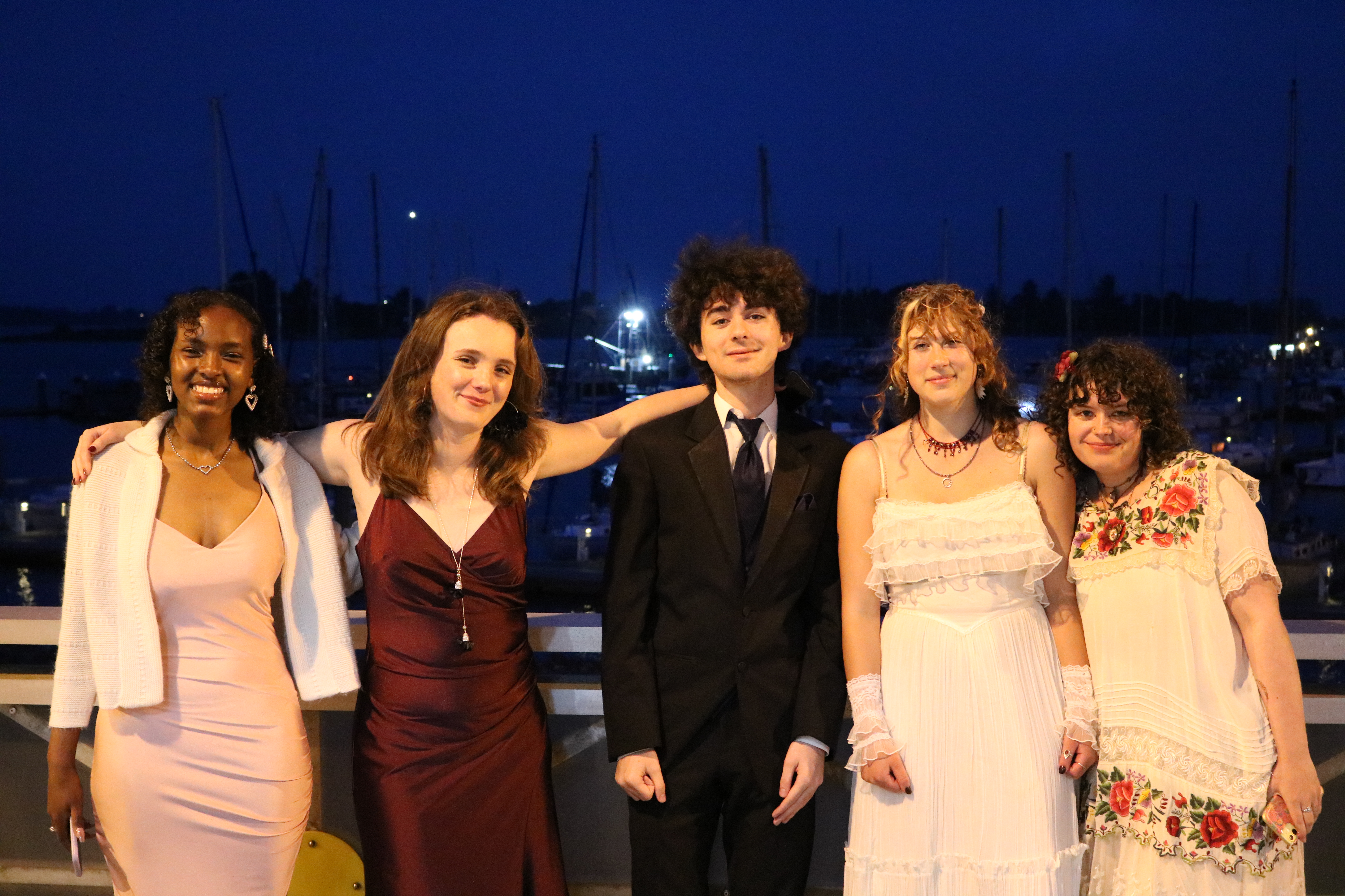 Students smile together in formal dresses and tuxedos during the annual Cotillion Ball at NPA.